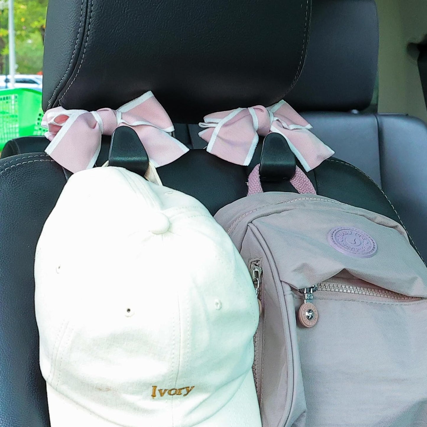 Gancho reposacabezas coche con moño organiz. negro y rosa