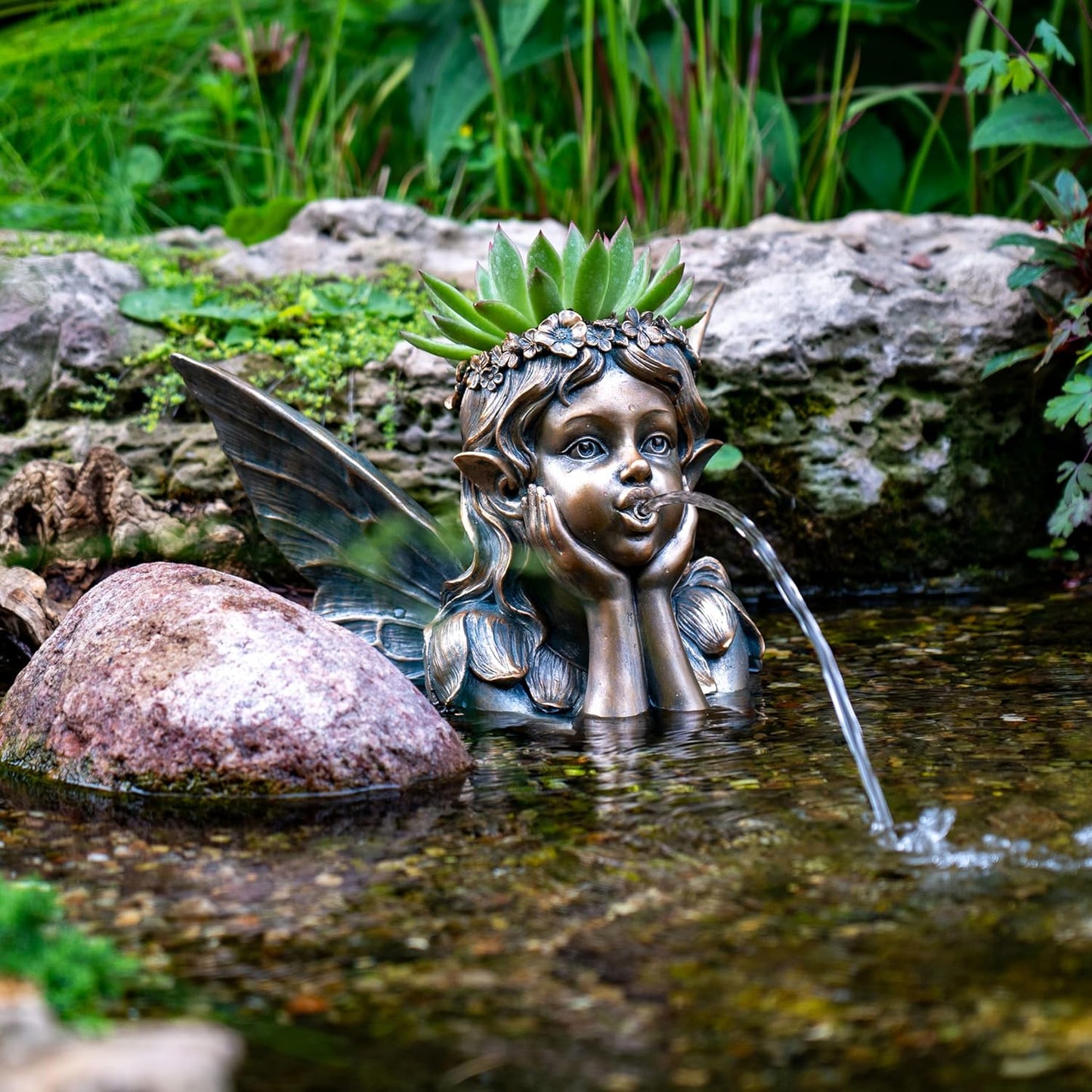 Fuente escupidor jardín estanque