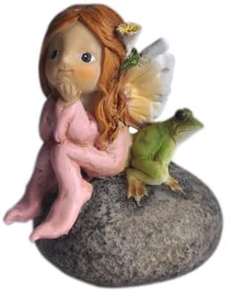 Estatua hada y rana en piedra jardín de hadas
