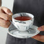 Juego taza café y platillo cerámica mármol color dorado