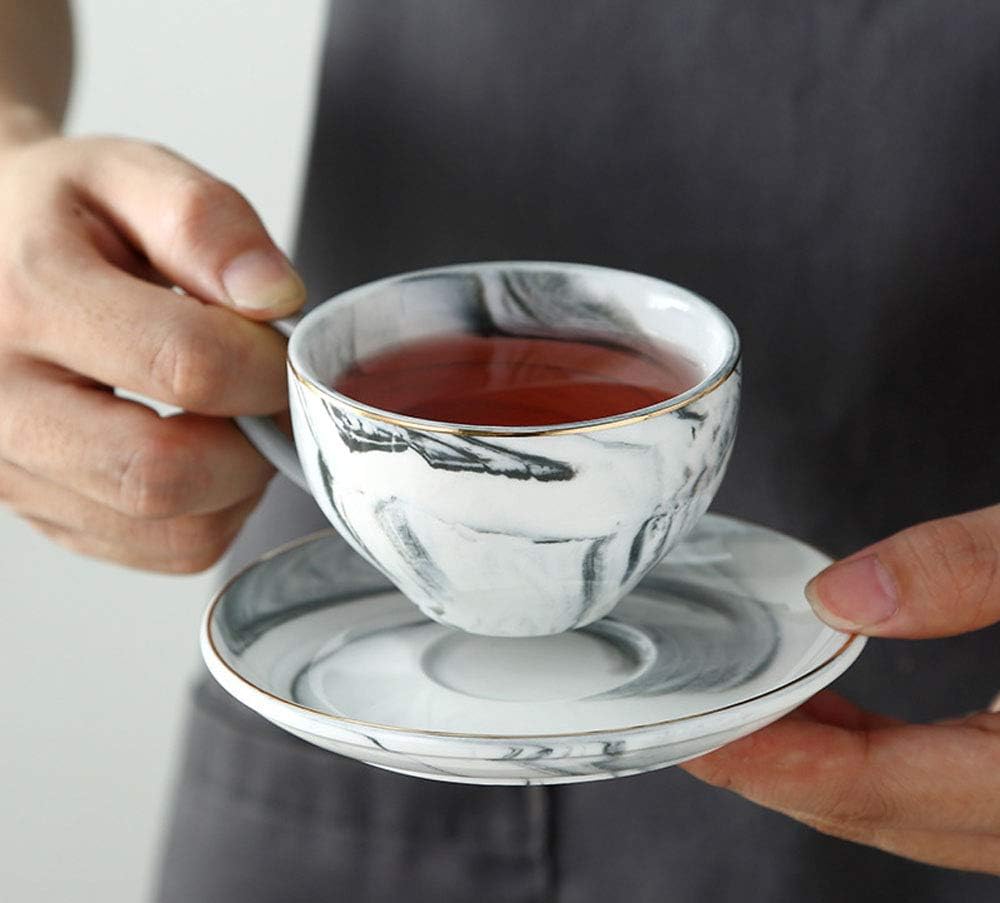 Juego taza café y platillo cerámica mármol color dorado