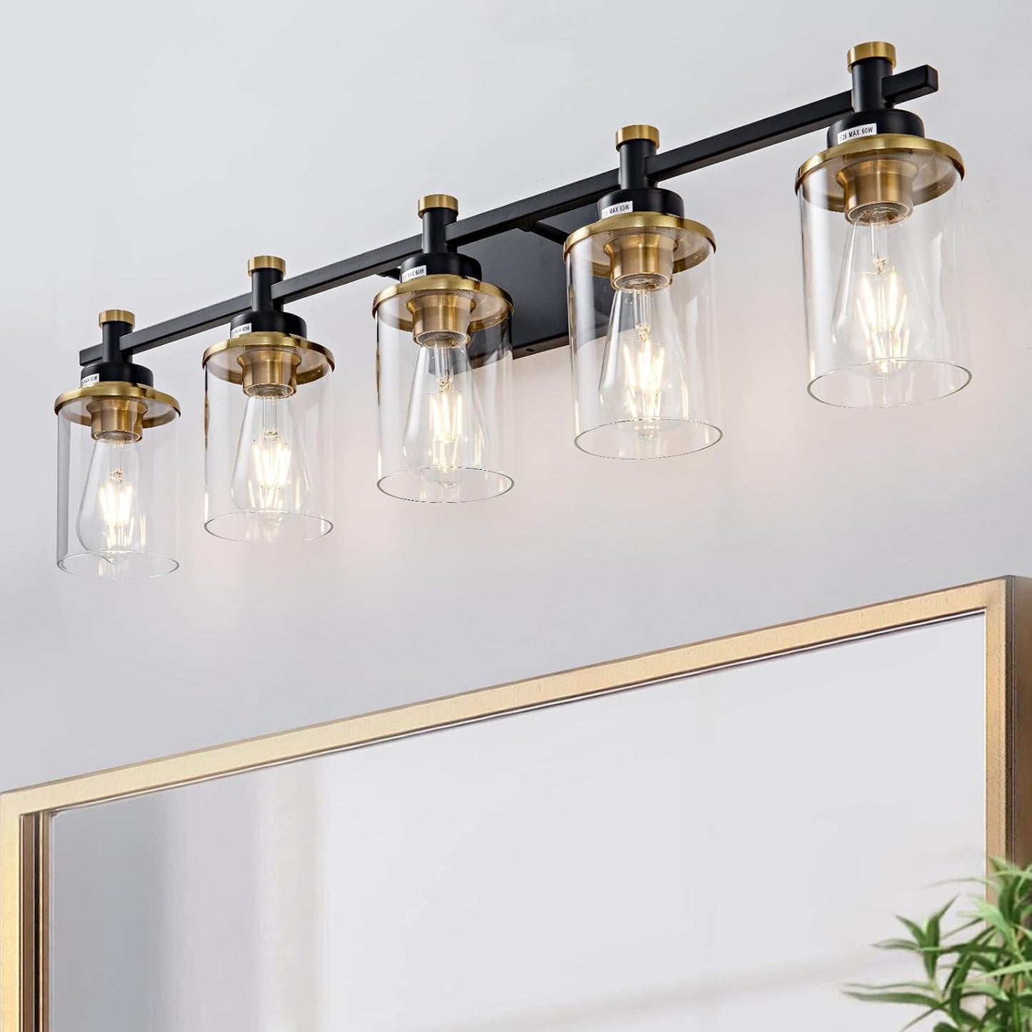 Lámpara baño 5 luces dorado y negro sobre espejo