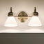 Lámpara baño 2 luces vidrio ópalo bronce champán montaje