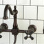 Grifo cocina puente montaje pared bronce aceitado