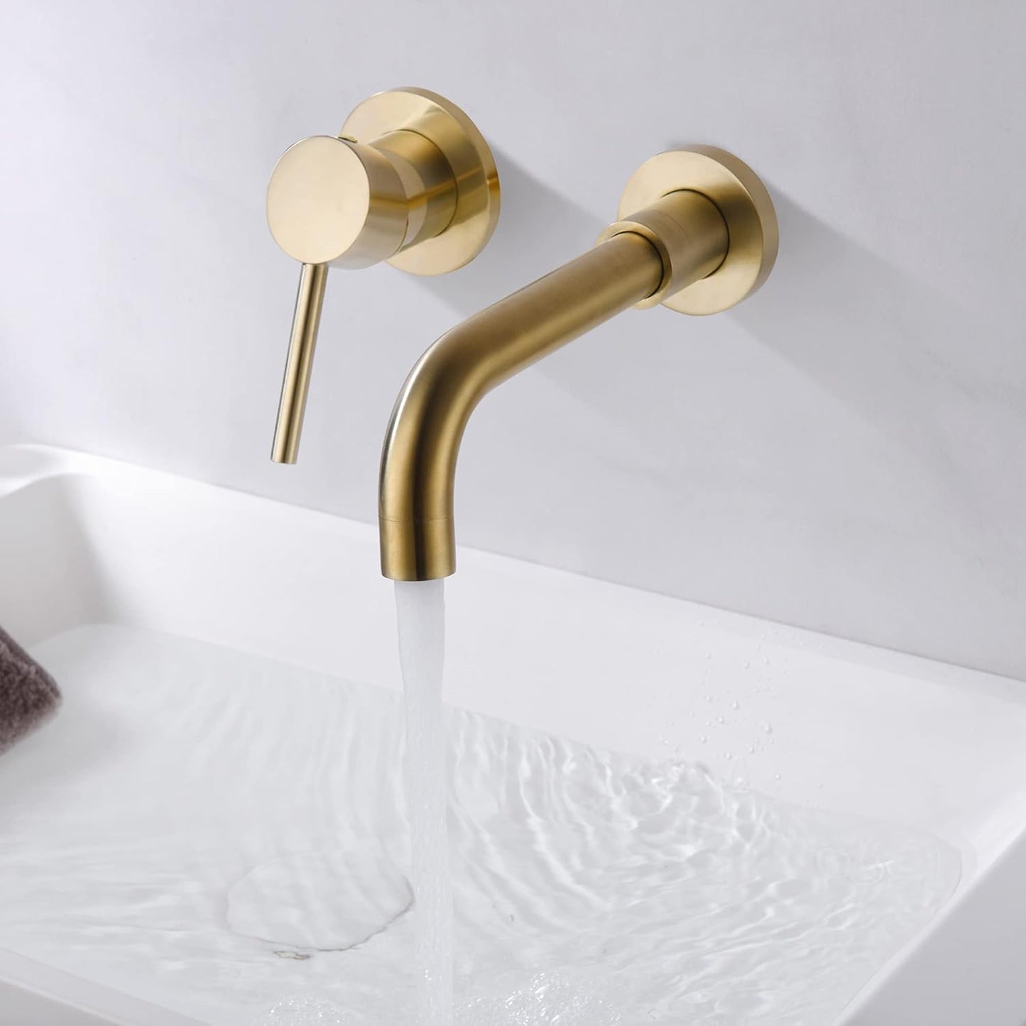Grifo baño pared manija zurda oro cepillado