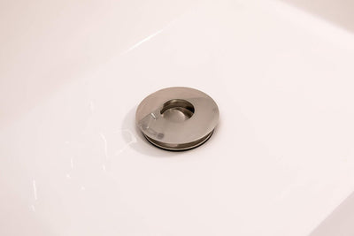 Desagüe baño universal con botón pulsador níquel cepillado