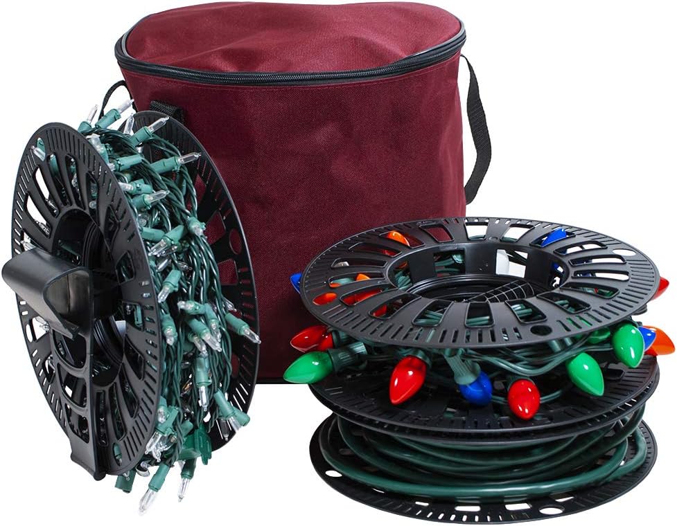 Soporte carrete luces navideñas 3 ruedas con bolsa poliéster