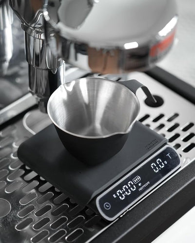 Taza medidora espresso con doble boquilla acero