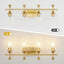Lámpara baño 4 luces 29" oro cepillado vidrio transparente