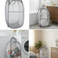 Cesta plegable para ropa sucia con asas gris
