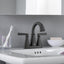 Grifo baño 2 manijas centro 4pulg latón negro mate