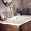 Grifo lavabo baño oro bronce doble curva con placa