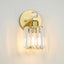 Lámpara baño dorada 1 luz pantalla cristal transparente