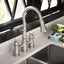 Grifo cocina acero inox puente abatible dos manijas