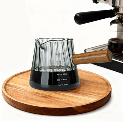 Taza medidora 6oz vidrio borosilicato desagüe V gris