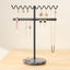 Soporte collares metal negro ondulado base mármol