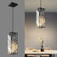 Lámpara colgante negra moderna con candelabros cristal