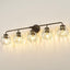 Lámpara baño 5 luces bronce aceitado globo vidrio ondulado