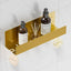 Organiz. baño 12pulg acero inox 2 ganchos dorado cepillado
