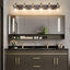 Lámpara baño 6 luces sobre espejo bronce cepillado