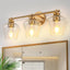 Lámpara baño 3 luces doradas cubiertas copa vino moderna