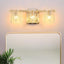 Lámpara baño 3 luces sobre espejo oro cepillado moderna