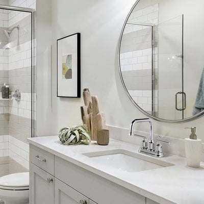 Grifo baño 4pulg cromado con set central y tapón desagüe