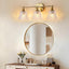 Lámpara baño 3 luces sobre espejo vidrio dorado