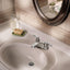 Grifo baño arco bajo dos manijas cromado