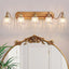 Lámpara baño vintage 5 luces dorada sobre espejo