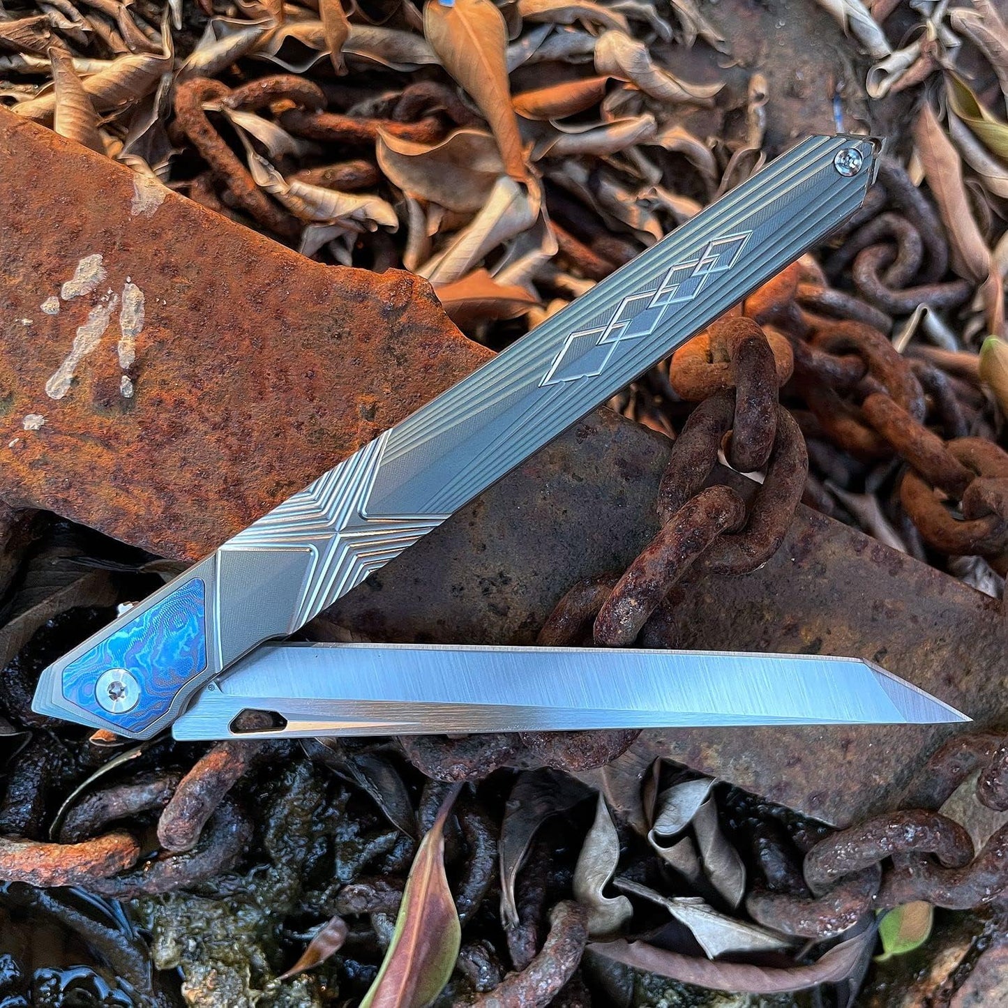 Cuchillo plegable M390 acero mango titanio EDC