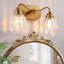 Apliques baño dormitorio luz dorada acabado latón antiguo