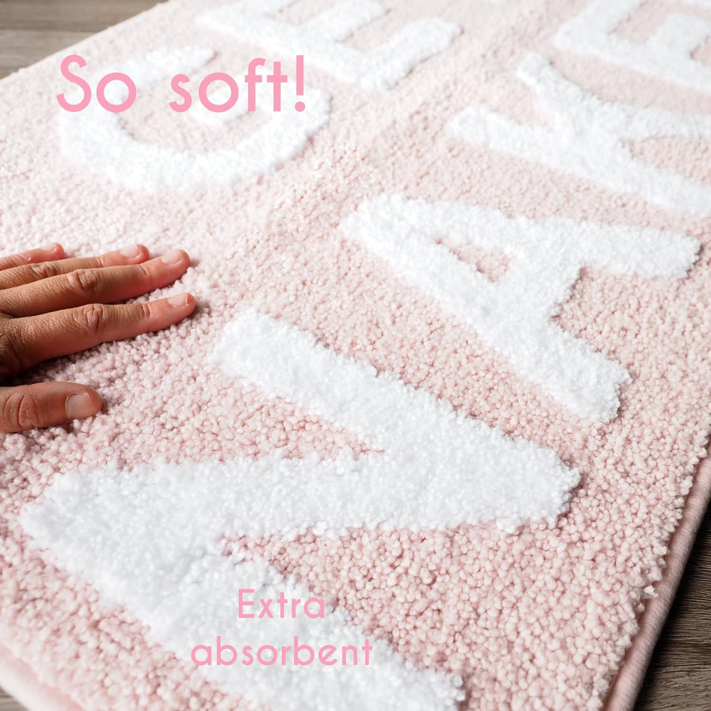 Alfombra baño texto Get Naked antiderrap rosa claro