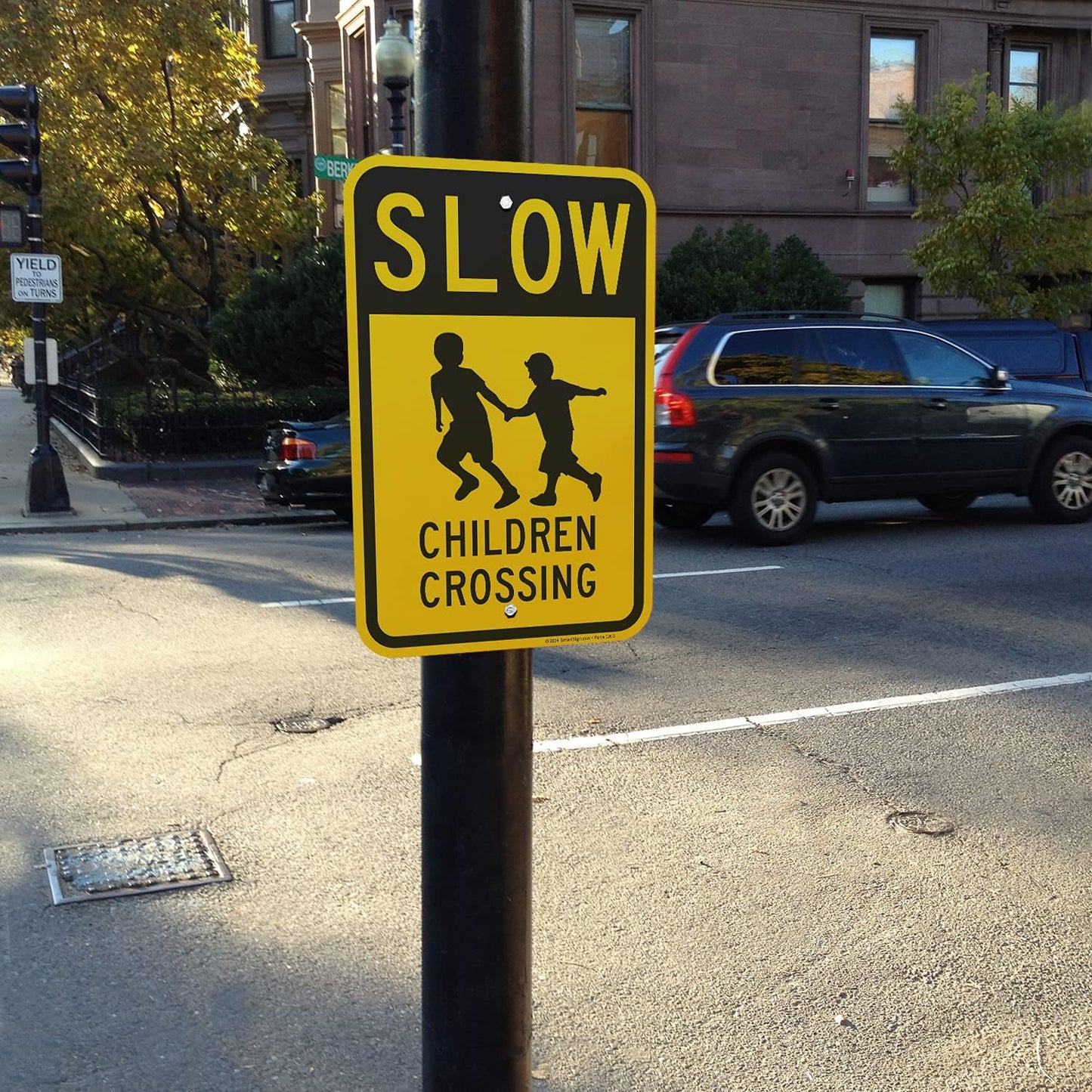 Letrero aluminio Slow Children Crossing 18x12" negro