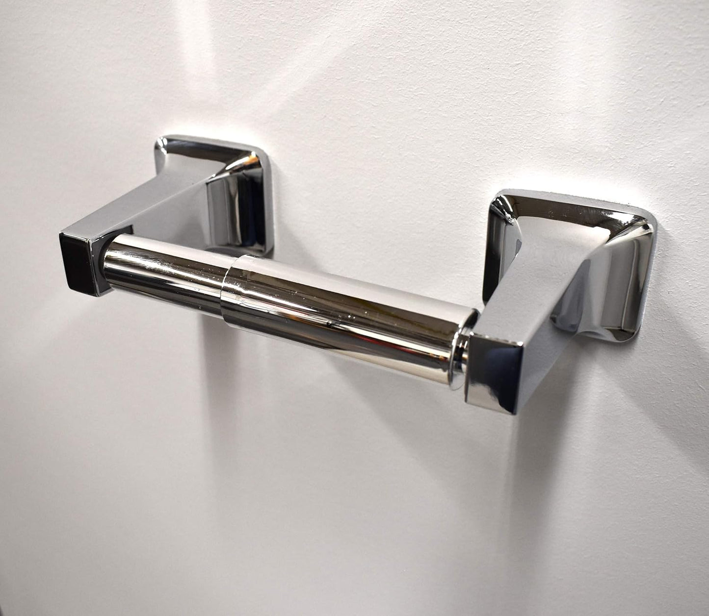 Soporte universal rodillo papel higiénico resorte cromado