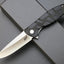 Cuchillo plegable D2 acero G10 mango EDC camping negro
