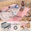 Manta playa impermeable resistente arena estacas