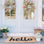 Felpudo Hello 17x29" color natural/negro