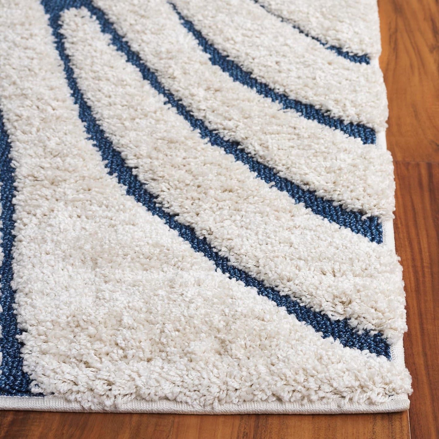 Alfombra decorativa 2'3"x4' crema y azul no pelusa 1.2"