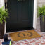 Tapete puerta entrada monograma 1'6x2'6 fibra coco al aire