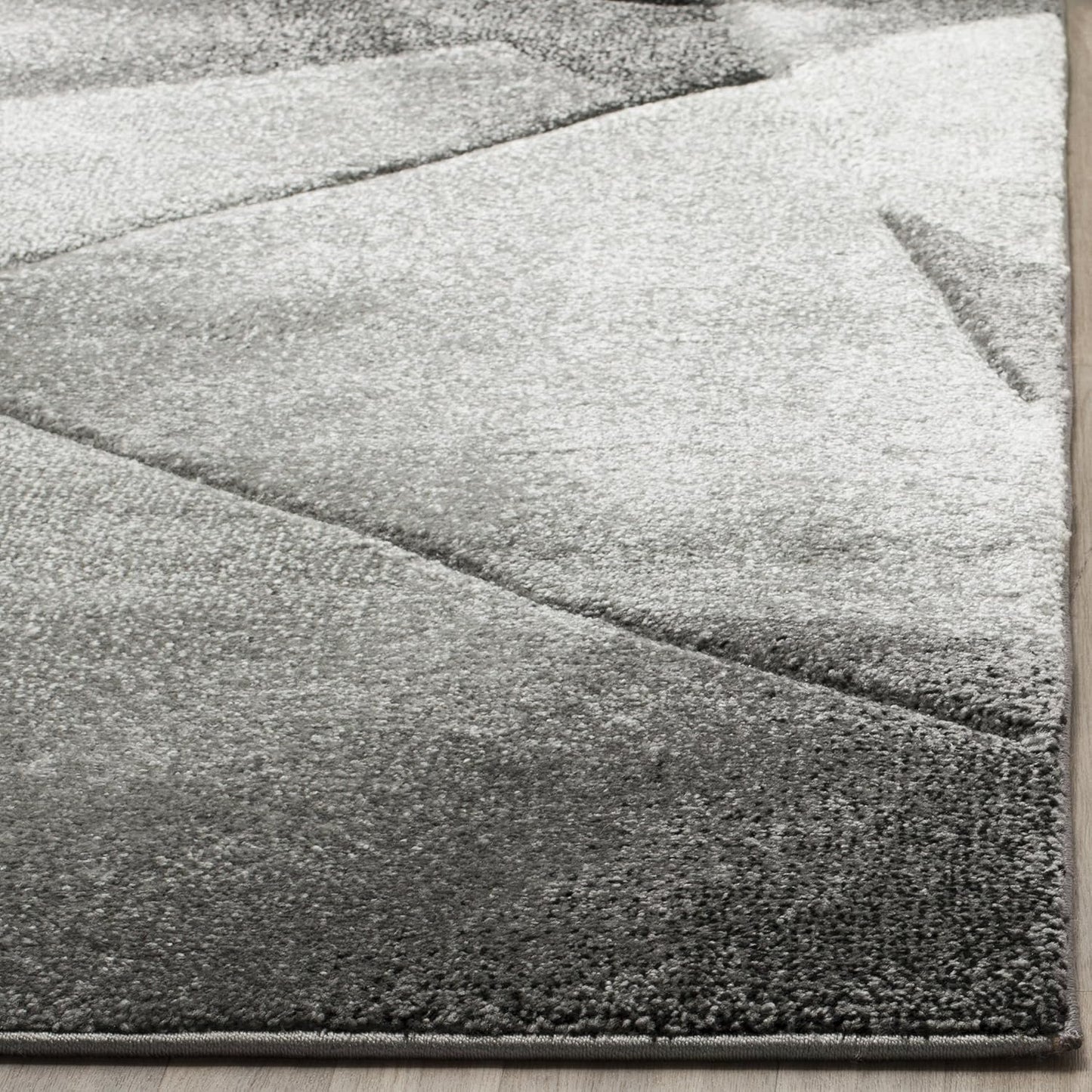 Alfombra decorativa 2'3x4' gris claro y carbón abstracta