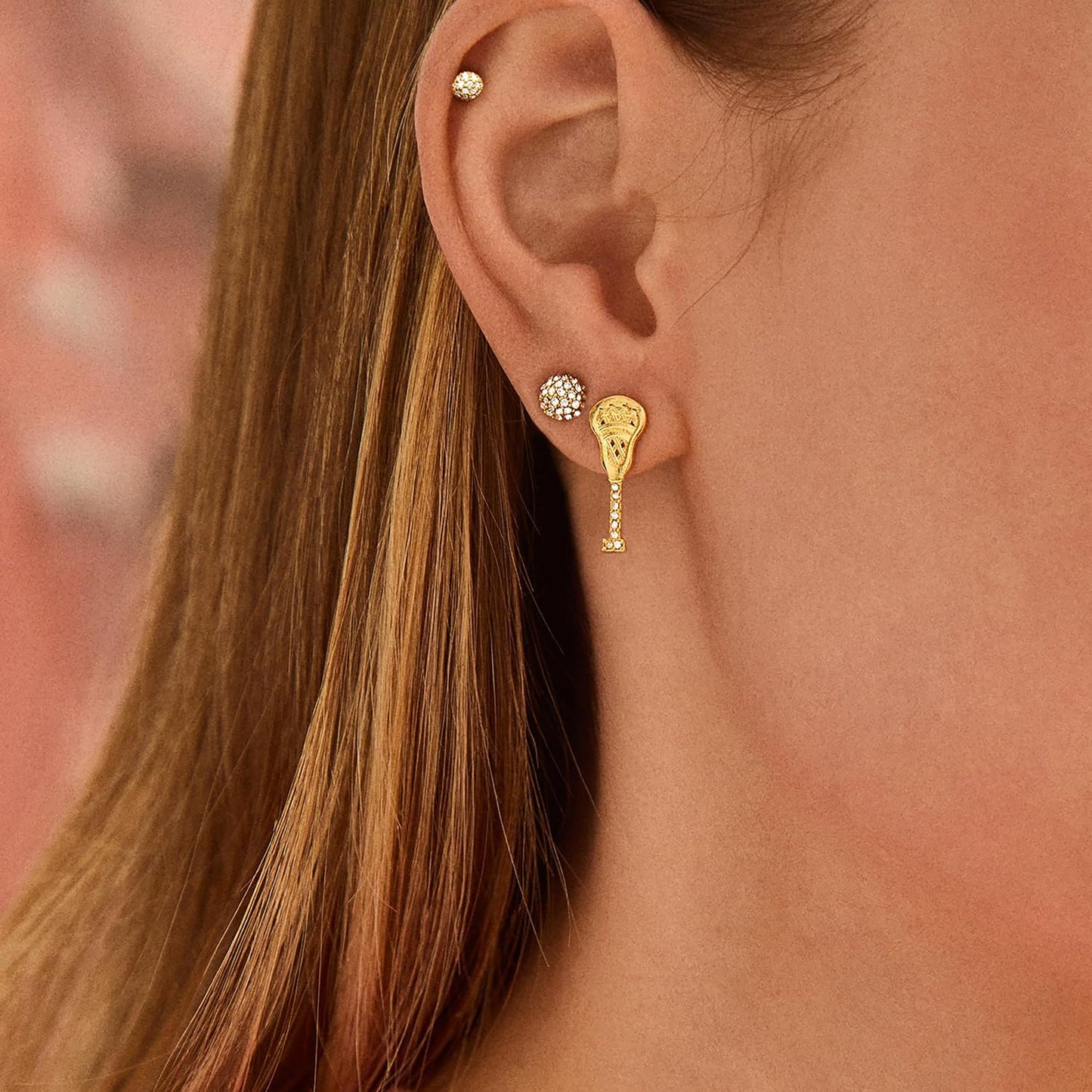 Aretes deportivos novedosos para mujer