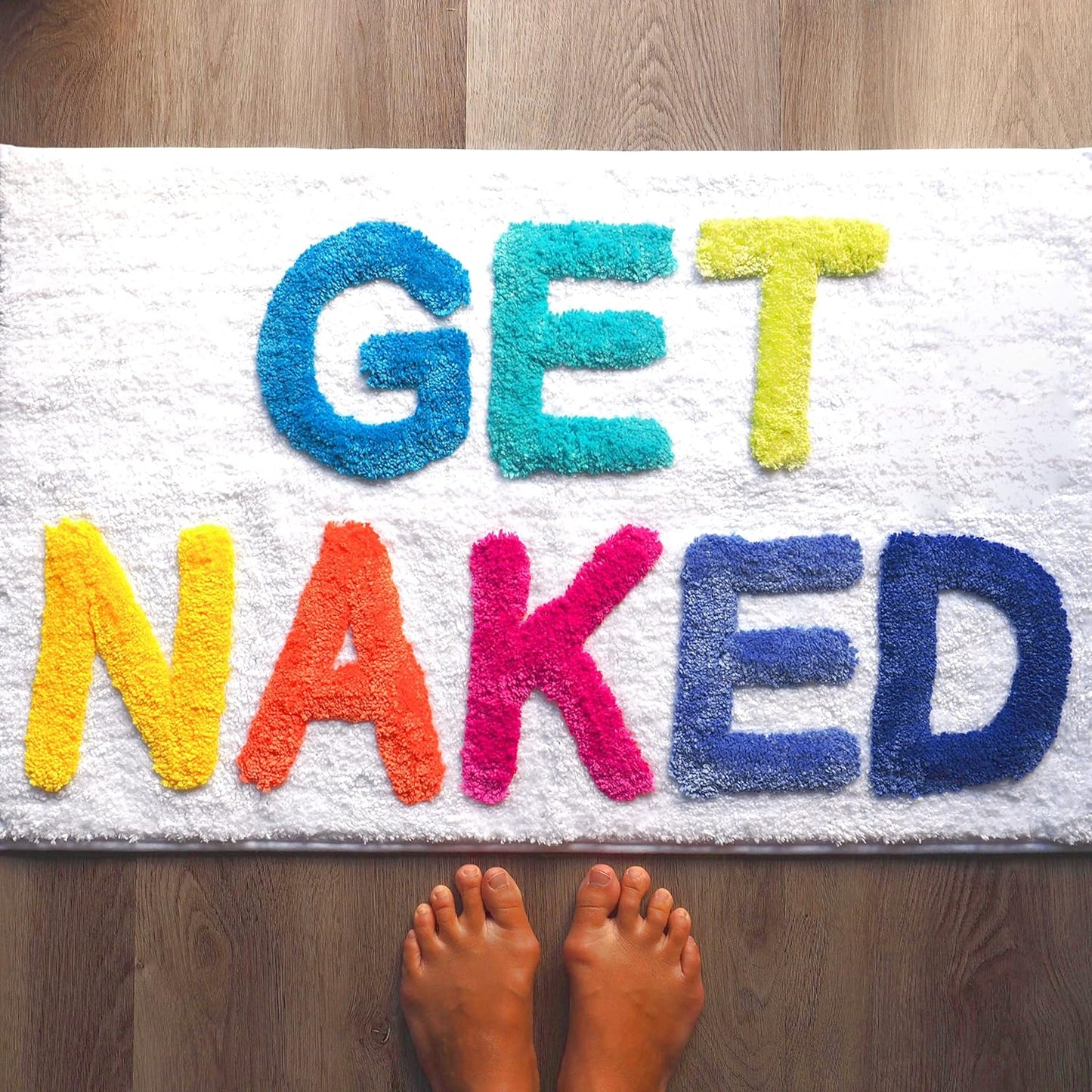 Alfombra baño antiderrap texto Get Nake 31.5x20"