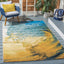 Alfombra área 5.3x7.6pies ondas tropicales azul y dorado